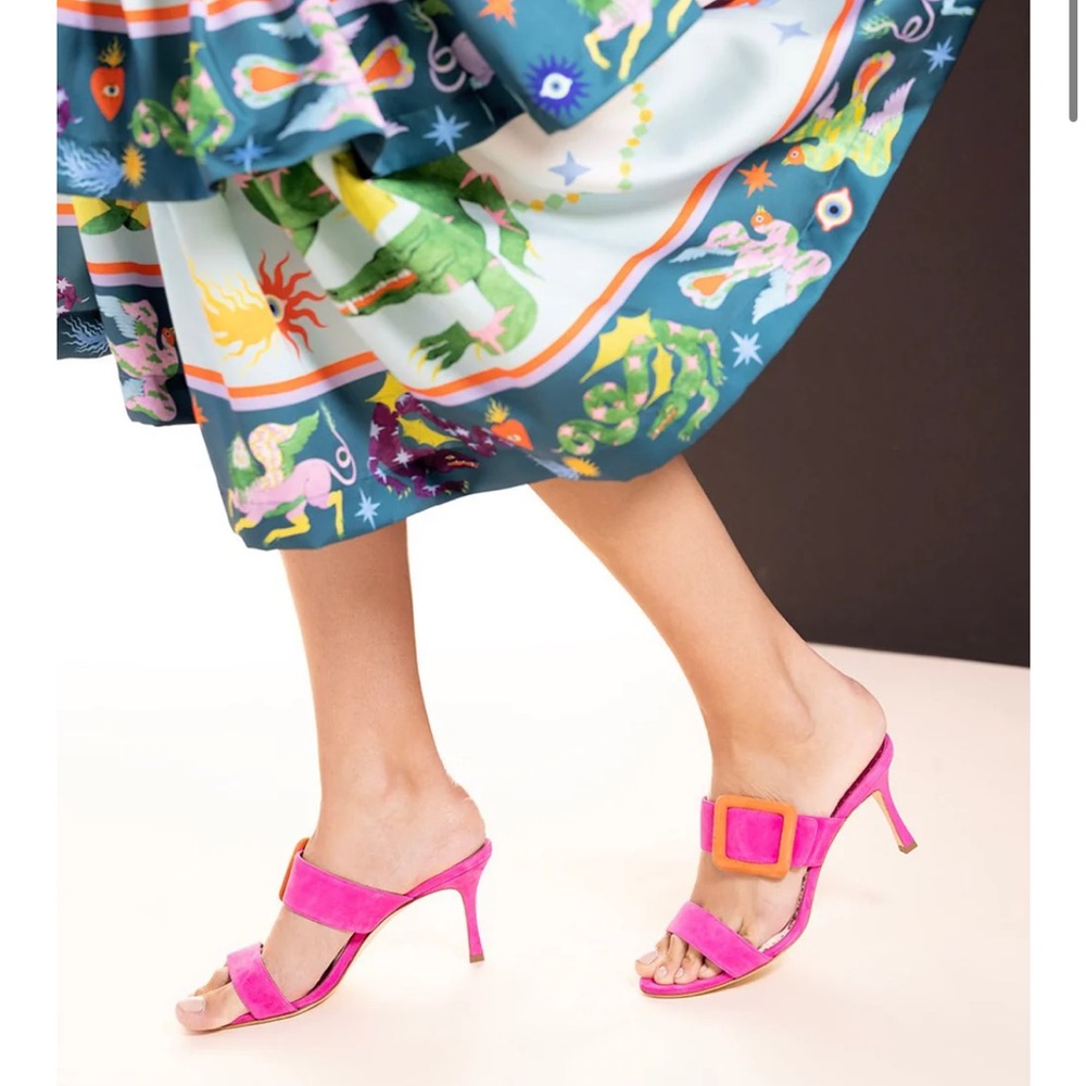 Manolo Blahnik gable mules in bright pink/orange.